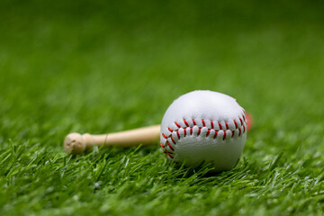 Obraz na płótnie Canvas Baseball is on green grass