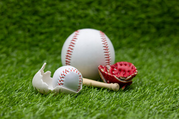 Baseball in egg shell for Easter Holiday on green grass
