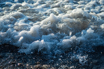 Blue and white foamy waves