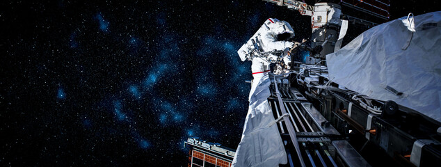 Astronaut spaceman do spacewalk while working for space station in outer space . Astronaut wear full spacesuit for space operation . Elements of this image furnished by NASA space astronaut photos.