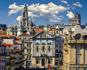 Porto city cityscape, typical blue tiled houses, building facades, red roofs and blue sky. Portugal.