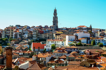 Fototapeta na wymiar Porto city cityscape, typical blue tiled houses, building facades, red roofs and blue sky. Portugal.