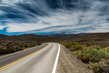dramatic empty and lonely back road in the California desert.