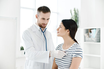 male doctor examines a patient in health hospitals