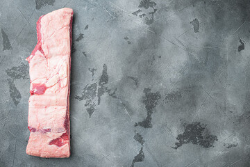 Raw beef ribs kalbi, on gray stone background, top view flat lay