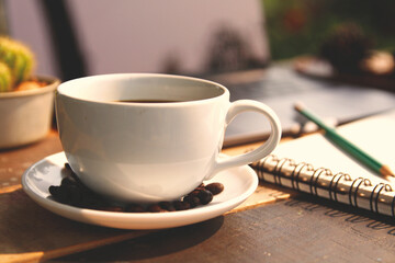 cup of coffee and a notebook