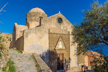Fototapeta na wymiar Traditional architecture with narrow stone street and agios nikolaos church in the medieval castle of Monemvasia, Lakonia, Peloponnese, Greece.