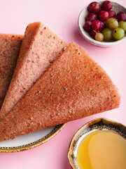 Fruit pastille of gooseberry and honey, fresh gooseberry. Russian pastila. Healthy raw vegan snack. Organic super food sweets. Vegetarian dietary food. Fruit leather. Sweets candy roll. Space for text