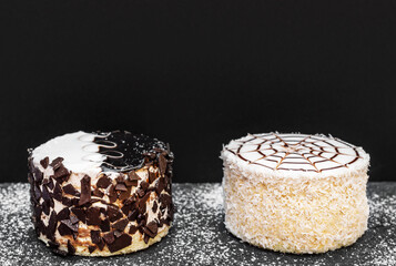 Small cakes on black background.