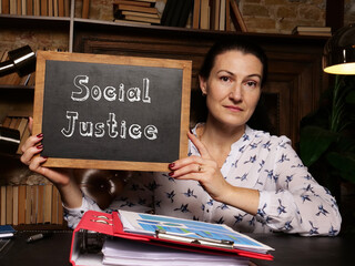 Fototapeta premium Business concept meaning Social Justice with sign on black chalkboard.