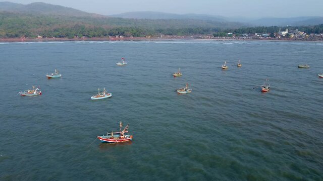 Fishing boats anchored off Ladghar beach at Dapoli, located 200 kms from Pune on the West Coast of Maharashtra India.
