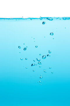 Many bubbles Floating from the middle of the blue water To the surface with little waves Blue liquid background