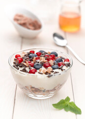 Healthy breakfast with granola and wild berries