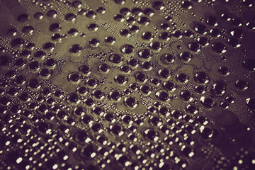 Water droplets on the film. Evaporation of moisture on a transparent surface.