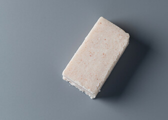 handmade salt soap bar on gray background