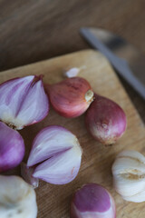Onion and garlic for cooking on old wooden background