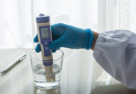 A person measuring the ORP of water . 