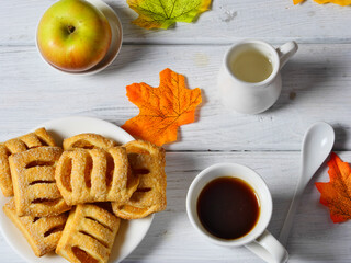 cup of tea with cookies and flowers