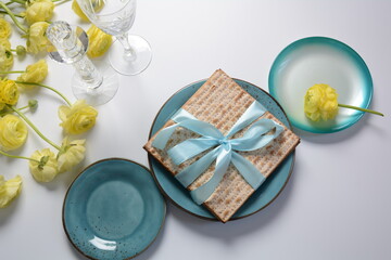Table served for Passover (Pesach) indoors, with matzah bread as symbolic Pesach (Passover Seder) item.