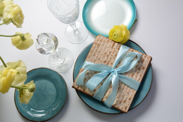 Table served for Passover (Pesach) indoors, with matzah bread as symbolic Pesach (Passover Seder) item.