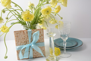 Table served for Passover (Pesach) indoors, with matzah bread as symbolic Pesach (Passover Seder) item.