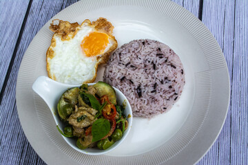 Rice and Curry is a Thai food that is decorated within plate beautifully and It is a popular food.