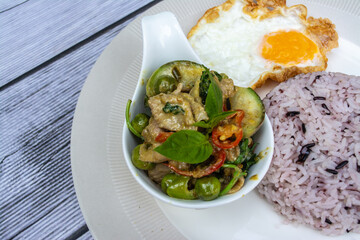 Rice and Curry is a Thai food that is decorated within plate beautifully and It is a popular food.