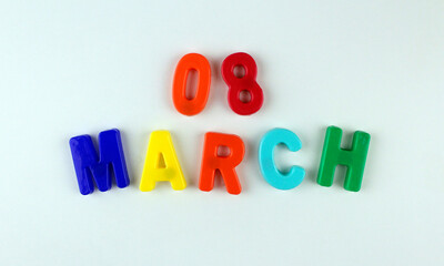 8 march by multicolored plastic letters on white background