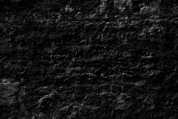 texture of dark wall covered with volumetric plaster, space for text, space for copy