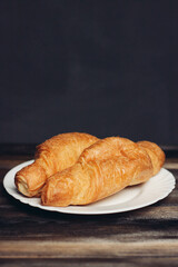 croissants on a white plate red mug kitchen appliances breakfast