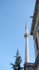 Obraz premium Baroque and old ancient ottoman architectural mosque of dolmabahce near istanbul bosphorus. Corner and part of architectural details. sunshine and sunny day. 03.03.2021. İstanbul Turkey.