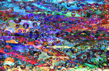 Fototapeta na wymiar A pattern of multicolored spheres of various diameters is located on a rainbow background. Abstract fantasy. 