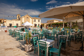The charming town of Marzamemi in Sicily. Summer view of the streets and the main square.