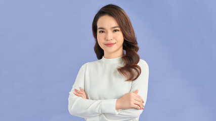 Young cute woman smiling confident with crossed arms.