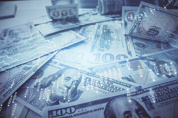 Multi exposure of forex chart drawing over us dollars bill background. Concept of financial success markets.