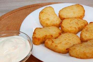 Potato pancakes from the oven with sour cream sauce.