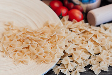 Italian pasta kitchen cooking wood table ingredients cherry tomatoes