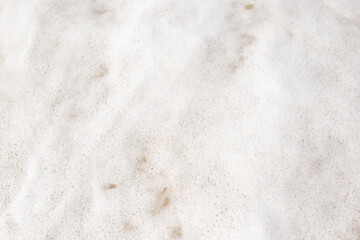 texture of sea foam with bubbles, close up. Top view.