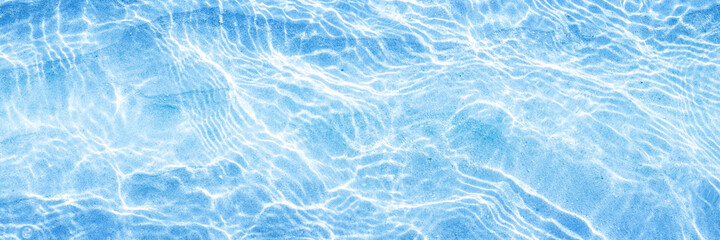 Obraz premium blue sea surface on a sunny day. Background. Top view. Banner.