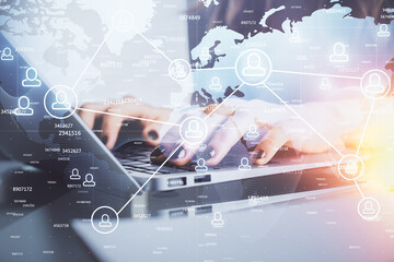 Double exposure of woman hands typing on computer and social network theme hologram drawing. People media concept.