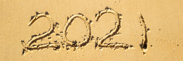 2012 figures written by hand on the sand of the beach. Banner.