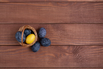 Easter composition of the Easter colored eggs cooked for the holiday on the wooden background Happy Easter 2021.