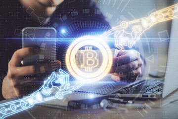 Double exposure of man's hands holding and using a phone and crypto currency blockchain theme drawing.