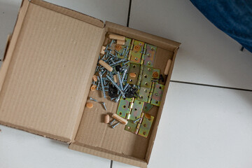 New disassembled cabinet on the floor in the kitchen of the apartment