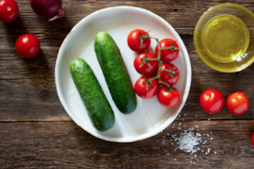 blur background food Fresh vegetables tomatoes and cucumbers on a rustic table