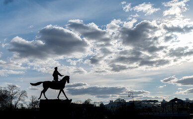 A monument silhouette to Marshal Zhukov on a horse that stands in the center of Moscow by the Kremlin.