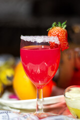 Close-up of a fresh cup of cocktail with strawberry, refreshing summer