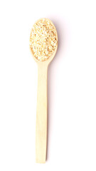 Top view of rolled oats in wooden spoon isolated on white