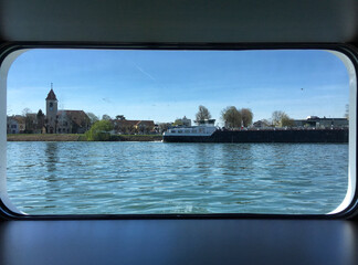 Standard river-view cabin stateroom with picture window on luxury river cruiseship or cruise ship...