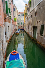 Venice canal, a green water surrounded by buildings